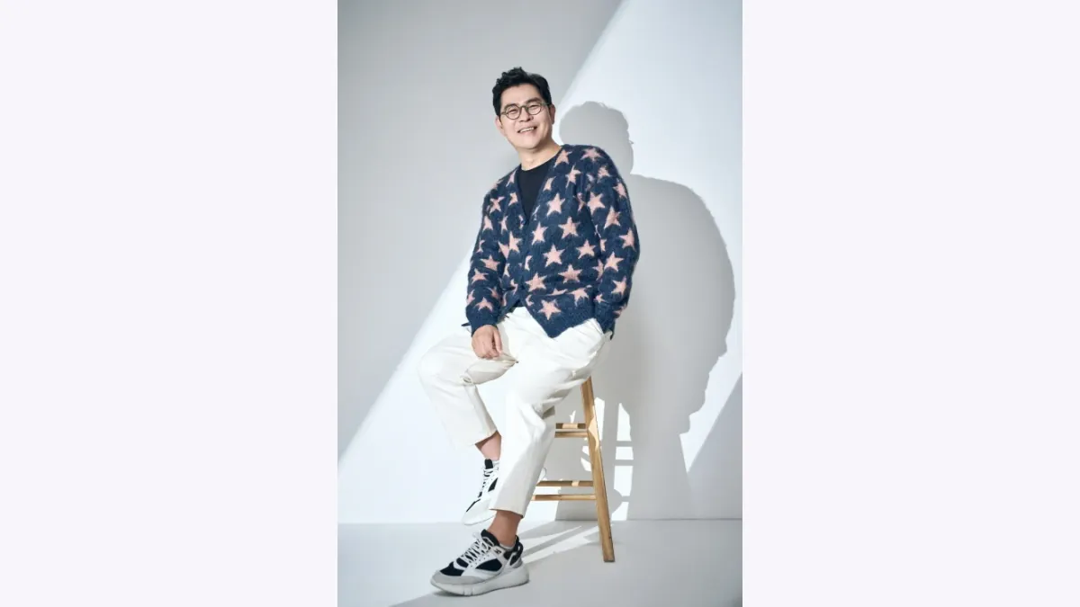 Kim Yong-man Face Reading: Raised Cheeks and Round Glasses
